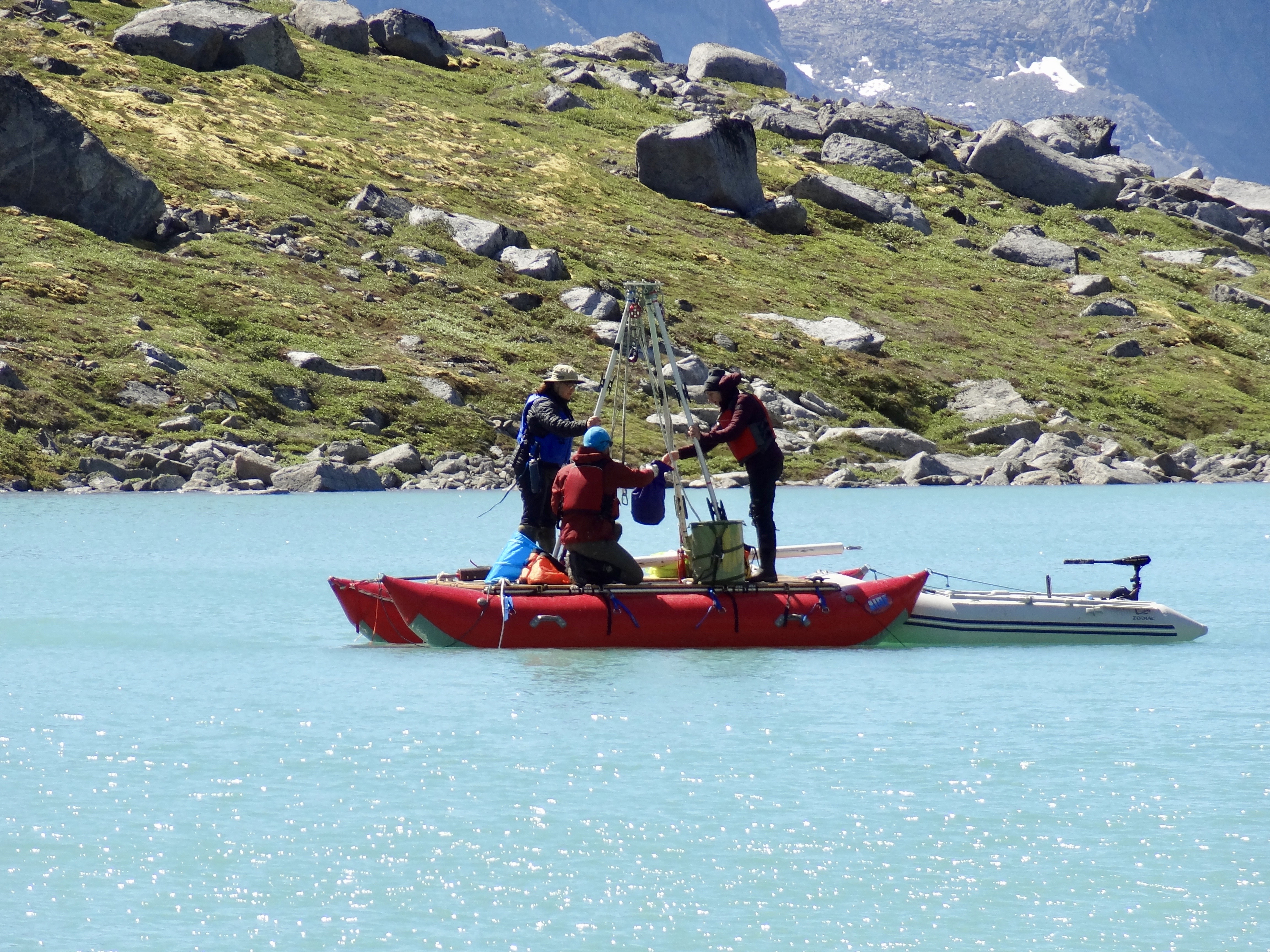 A team on a boat coring lakes in the Arctic (credit: Laura Larocca)